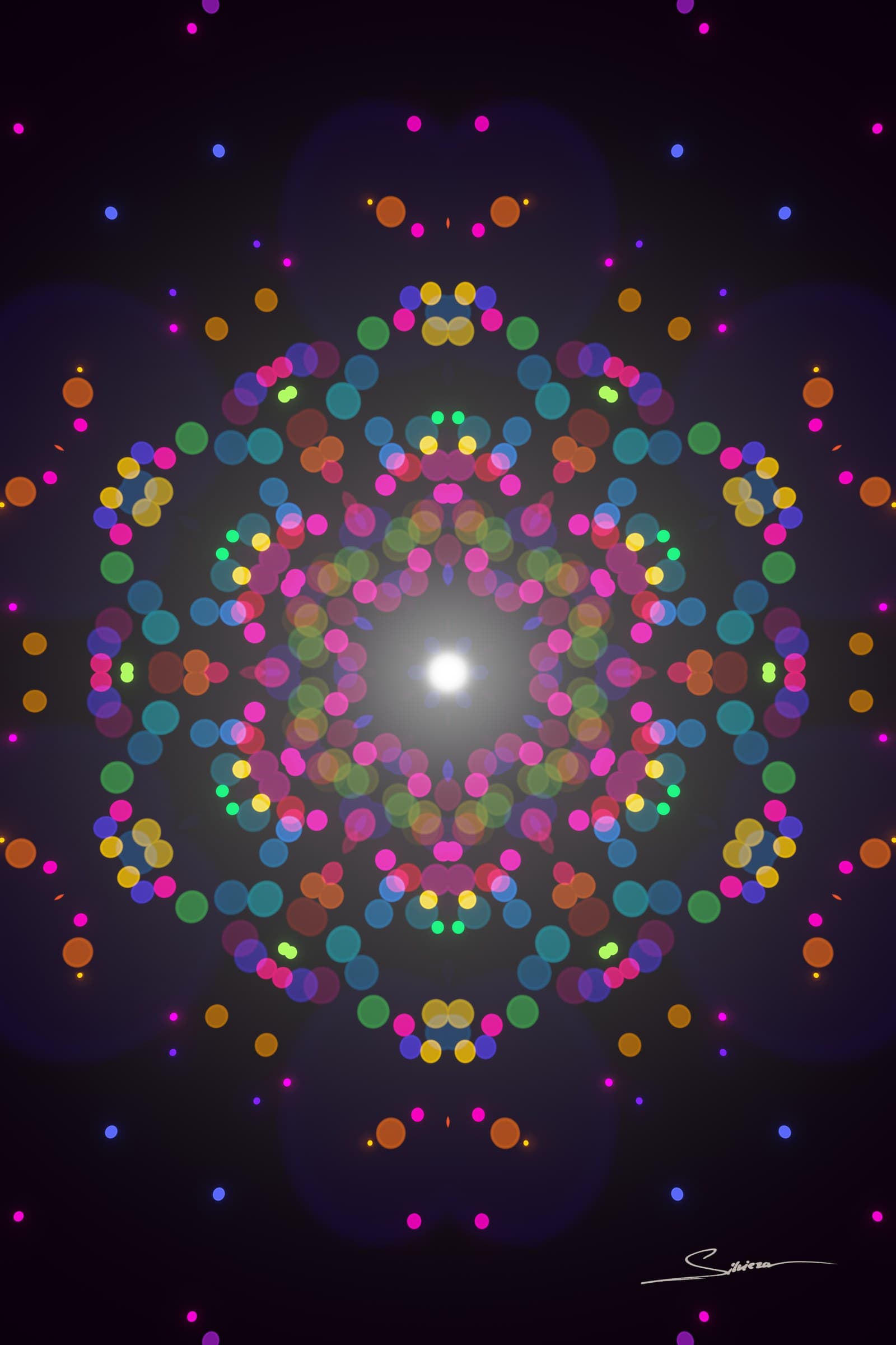 Sparks, from the Infinito series by George Silviero: a symmetrical view into a glowing center, in every colour of the rainbow.